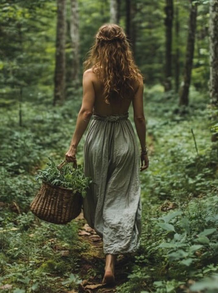 Person walking through a lush green forest carrying a woven basket